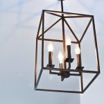 Square ceiling light with 3 candle bulbs.