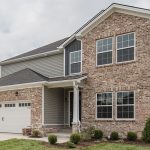Light brown brick home built by J Perry Homes